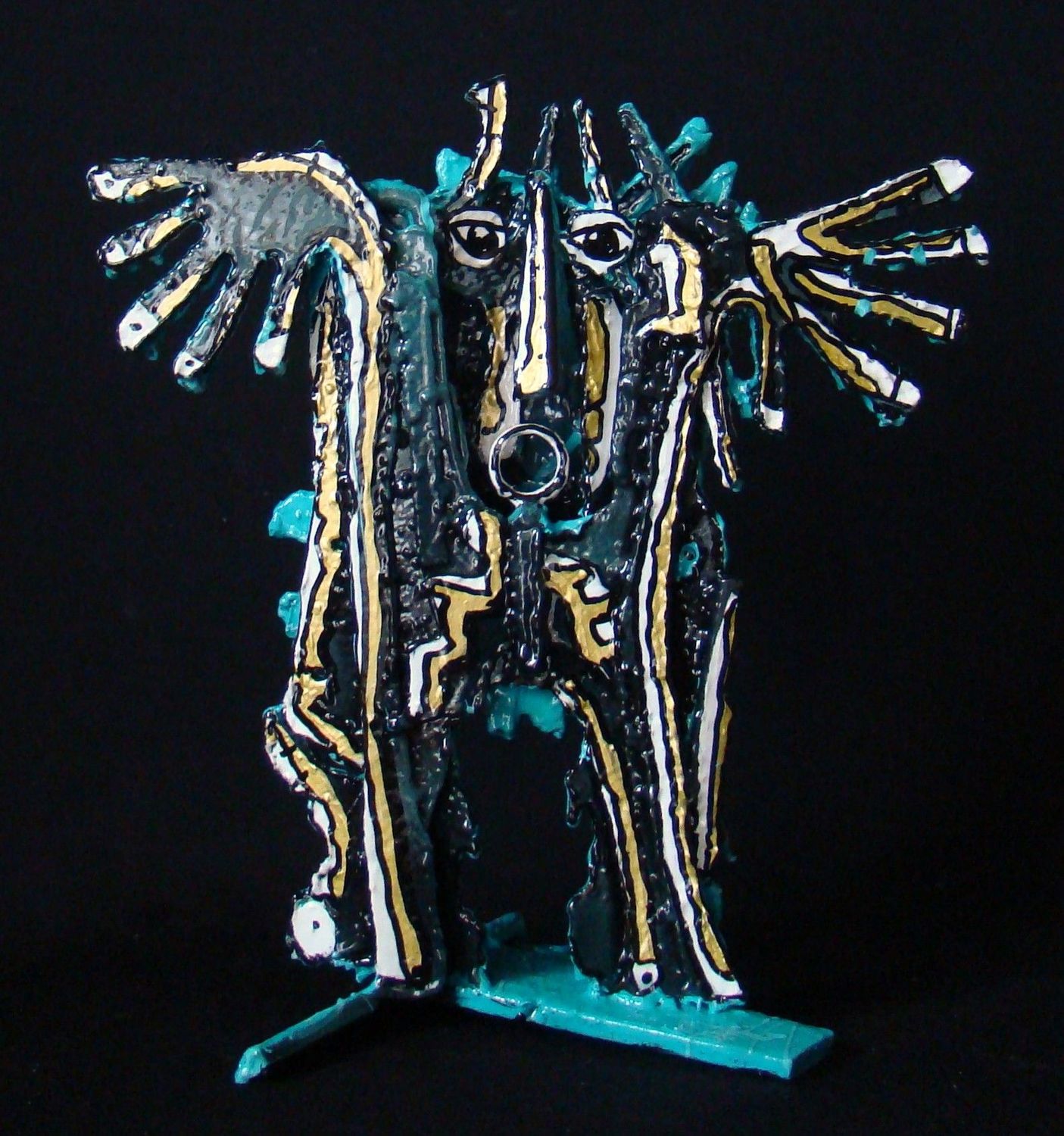 Sculpture de MICHADU a pour titre Petit Guerrier turquoise style graphique dim : MICHADUprix:800