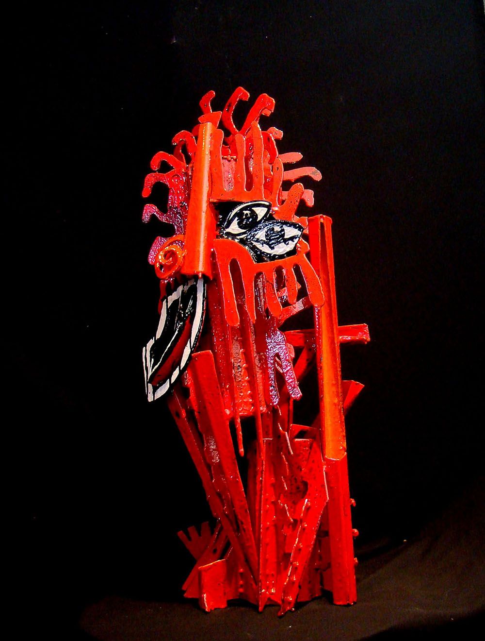 Sculpture de MICHADU a pour titre  JE VOIS DOUBLEMENT ROUGE style graphique dim : MICHADUprix:3400